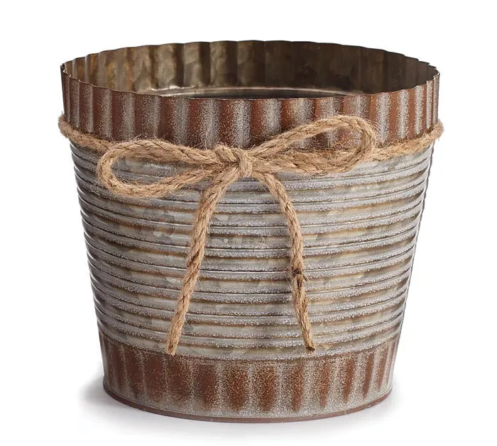 Small rustic brown tin pot cover with twine