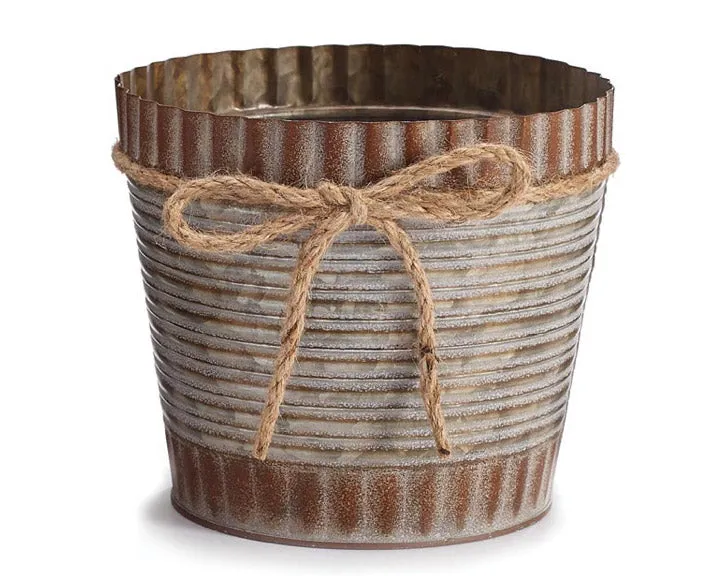 Small rustic brown tin pot cover with twine