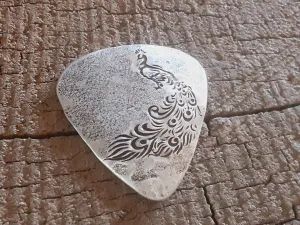 Sterling silver guitar pick with peacock