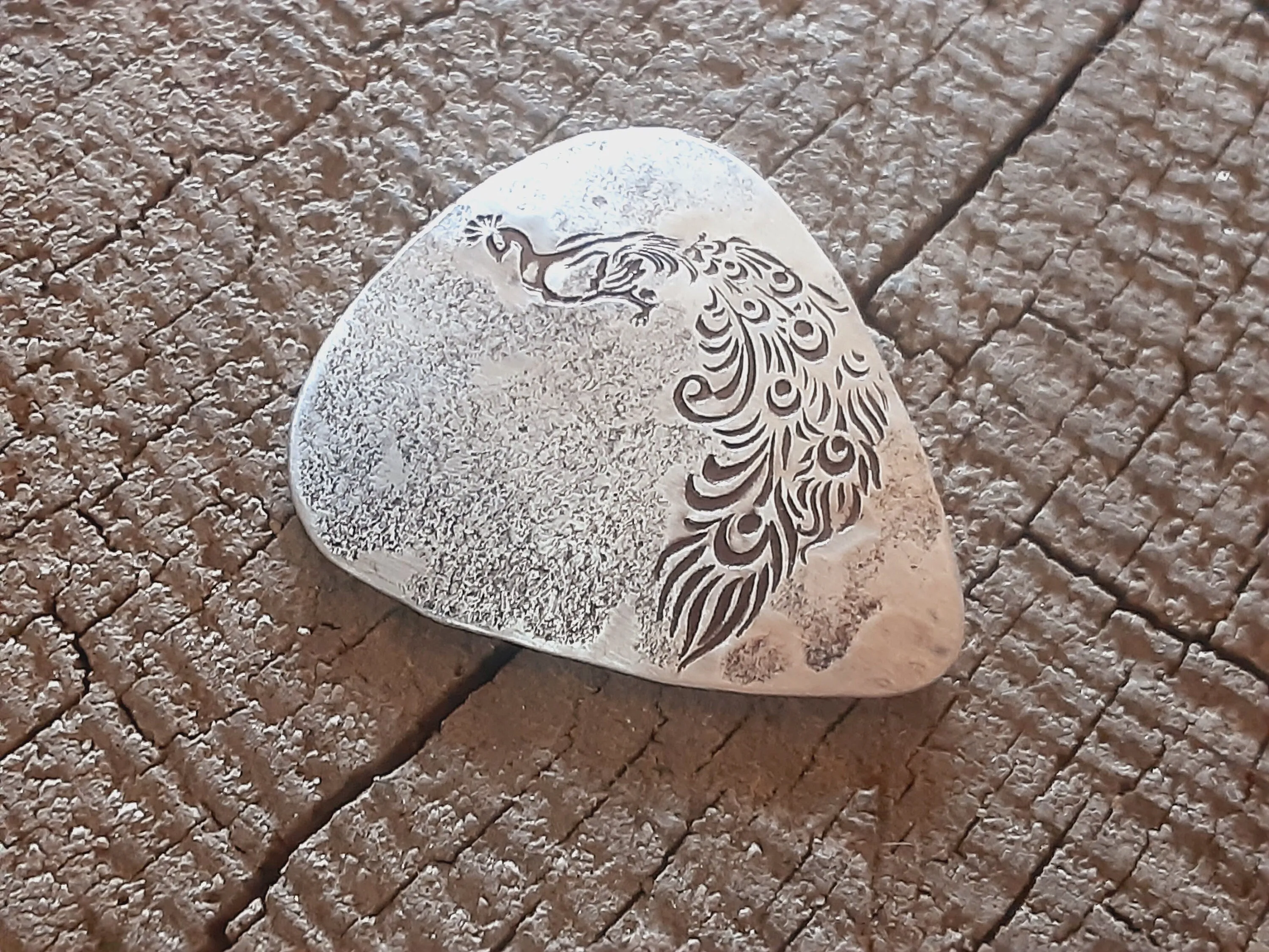 Sterling silver guitar pick with peacock
