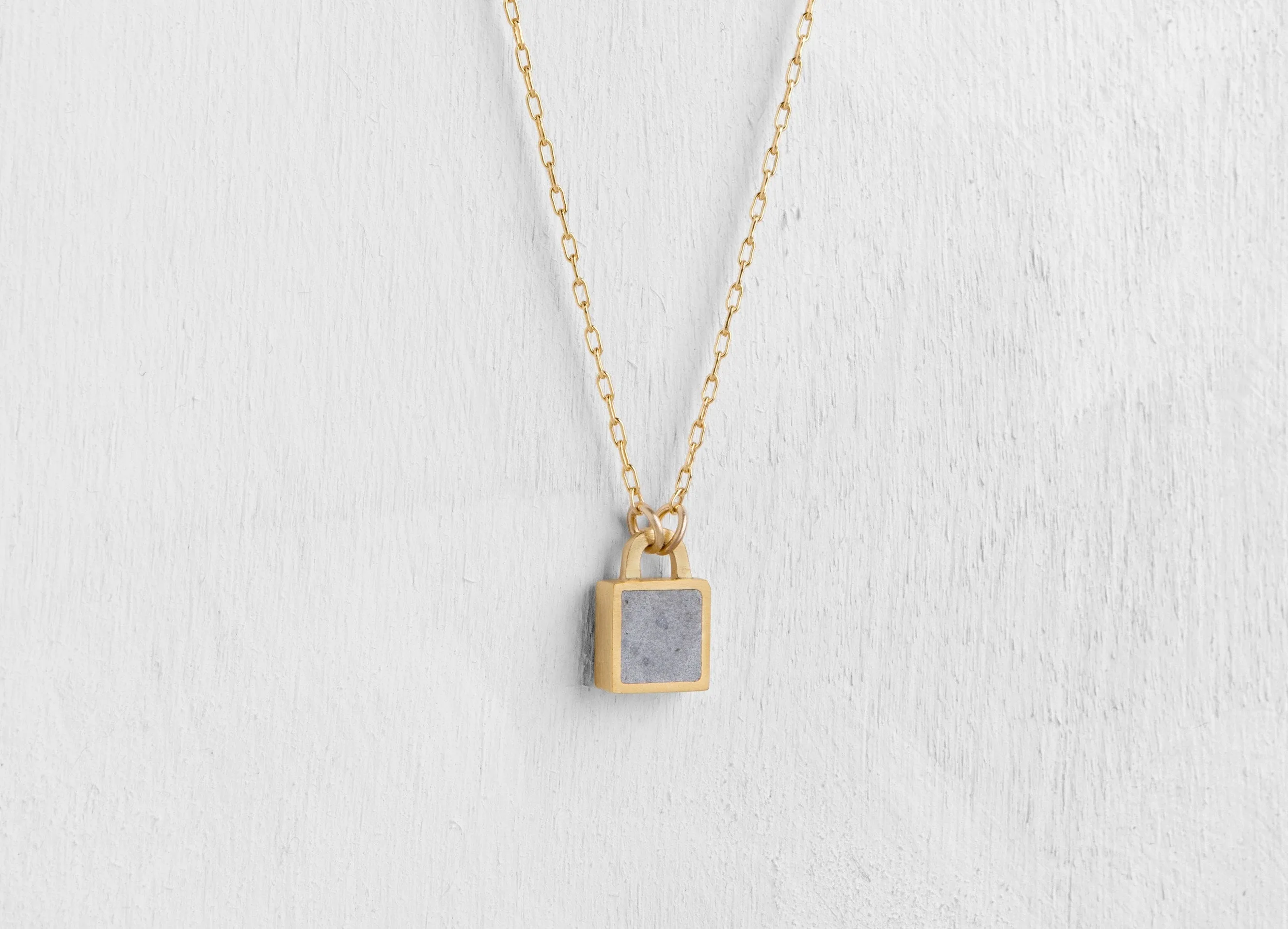 Tiny Sq Concrete & Gold lock pendant